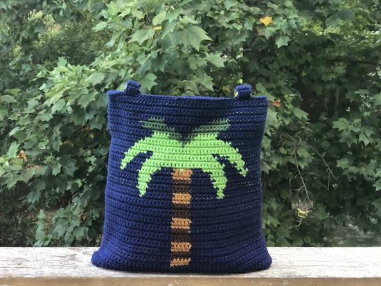 The Palm Tree Tapestry Bag carries a bit of summer wherever you may go. It's a great project for practicing tapestry with options to personalize the handles and bottom.