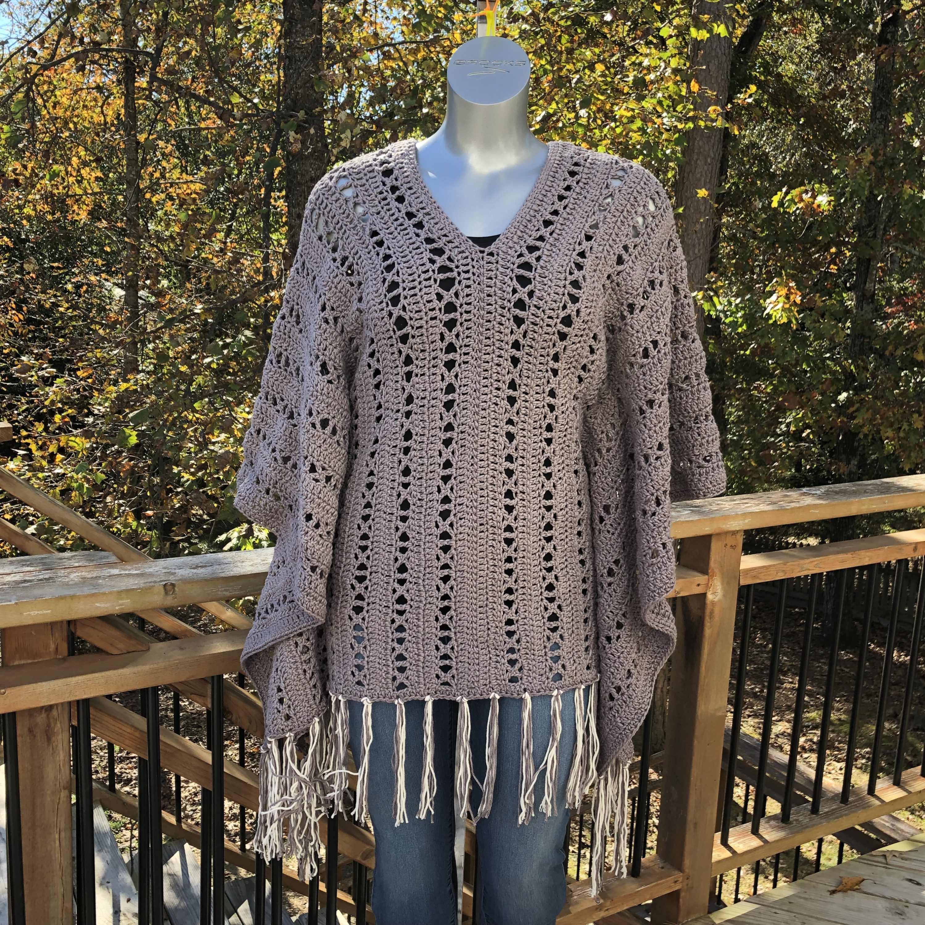 X-capade Poncho, a crochet pattern using worsted weight weight. It'll become your favorite poncho to wear no matter the weather.