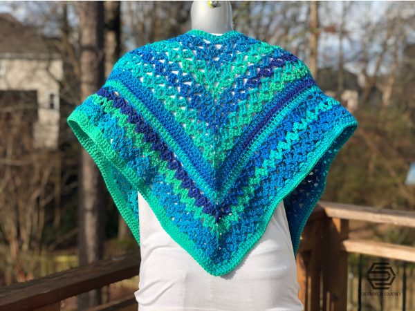 The Cascading Waterfall Wrap is an intermediate crochet pattern that uses less than 550 yards of worsted weight yarn.
