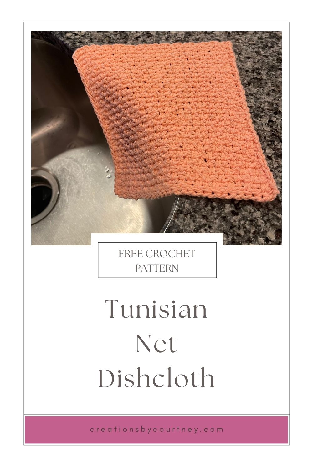 An image of a tunisian crochet dishcloth laying on the edge of a black and gray granite countertop and hanging down towards a stainless steel sink.