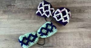 An image of two crochet hair bows. Each crochet hair bow is made in two colors of yarn. One is a mint background with blue diamonds, and the other bow is purple with a white and purple variegated diamonds.