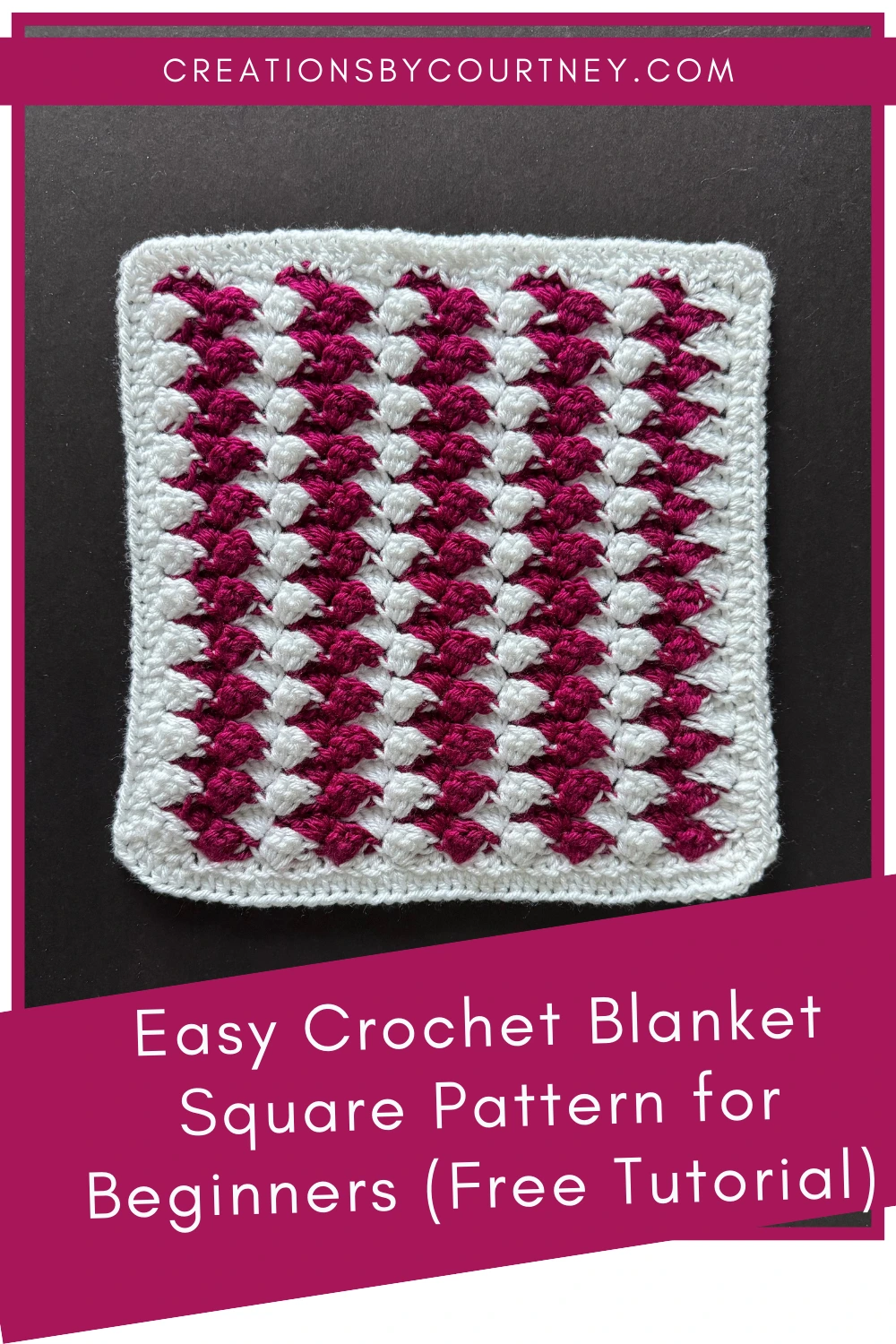 A pinterest pin with a close up of a crochet blanket square made in white and berry colored yarn. Each group of stitches alternates between the two colors for a fun, textured pattern of leaning shells.